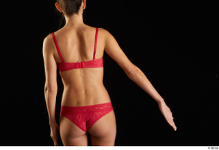 Waja   1 arm back view flexing red bra…